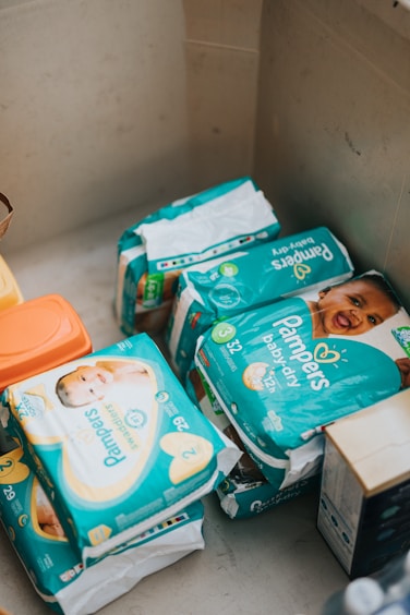 Packages of baby diapers collected inside a donation box