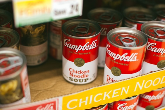 Cans of chicken noodle soup stocked for food bank distribution